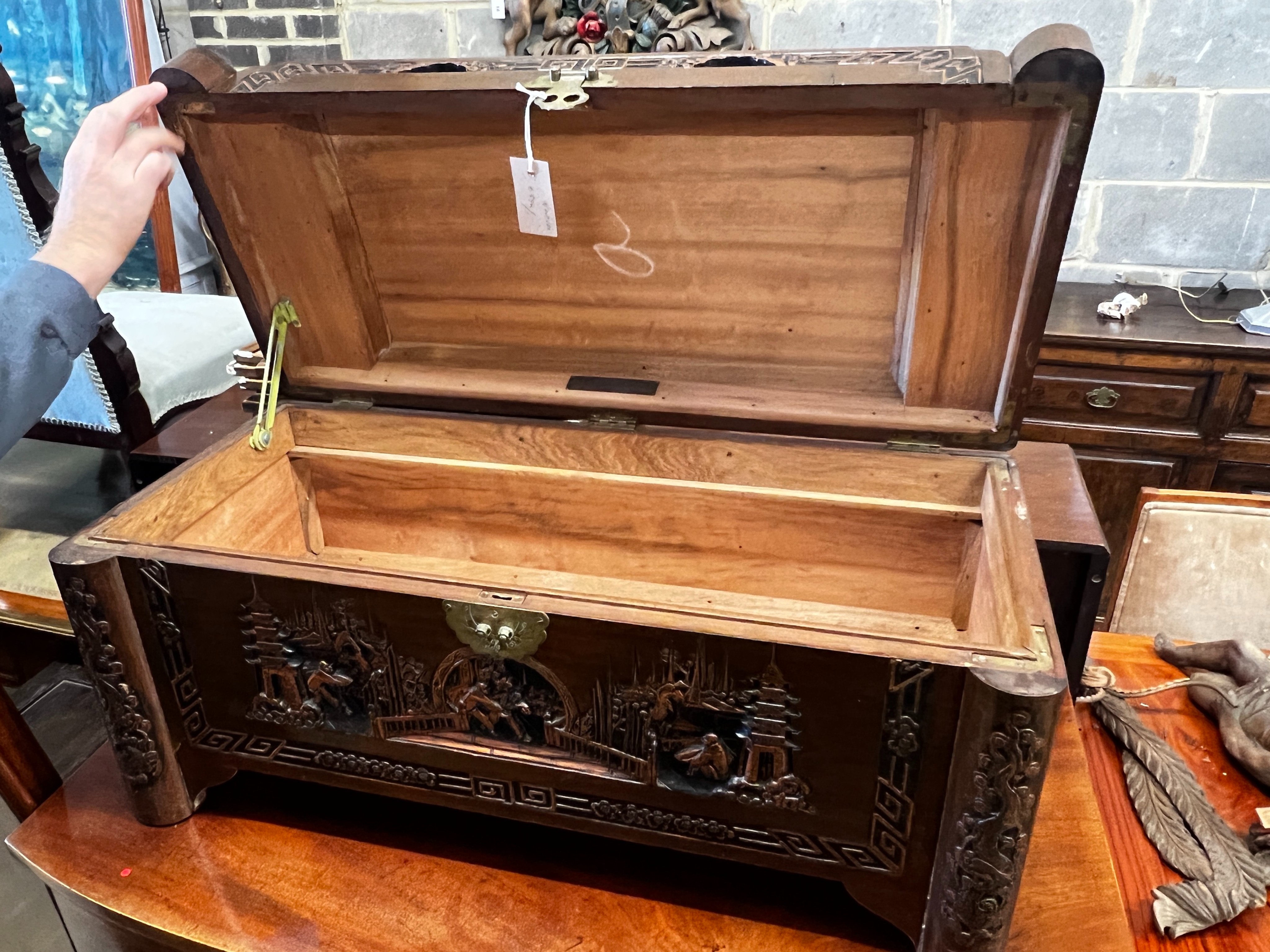 A small Chinese carved camphorwood trunk, length 80cm, depth 38cm, height 40cm